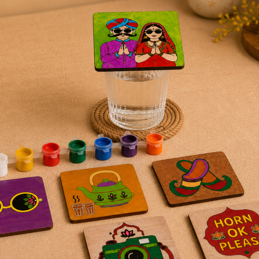 Hand-painted wooden coasters featuring camera, Punjabi couple and fun quote designs created with the Kalavio DIY Coaster Painting Kit